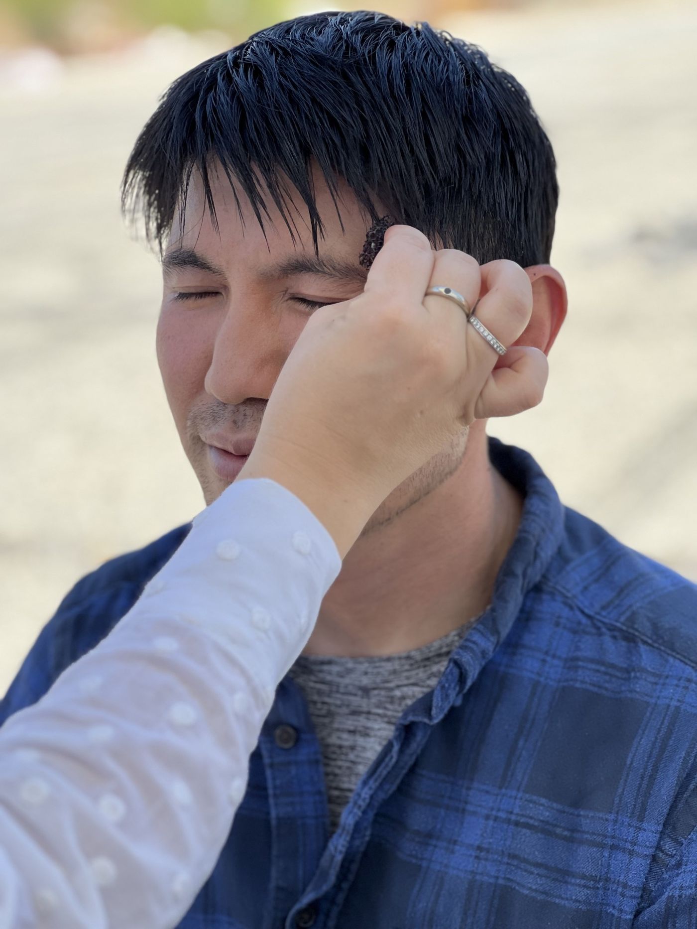 Medet Aman being made up for a scene, photo 3